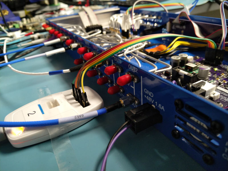 Back view of the crossbar showing SMA connectors for trigger I/Os