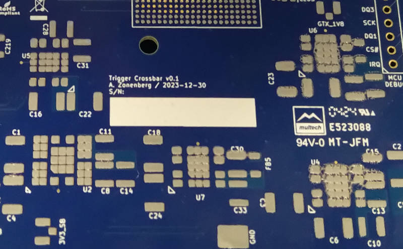 Slightly blurry photo of DC-DC module area with lots of smeared solder paste