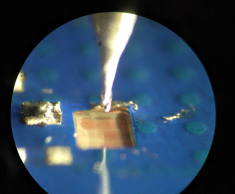 View through the microscope showing the beginnings of the hole
