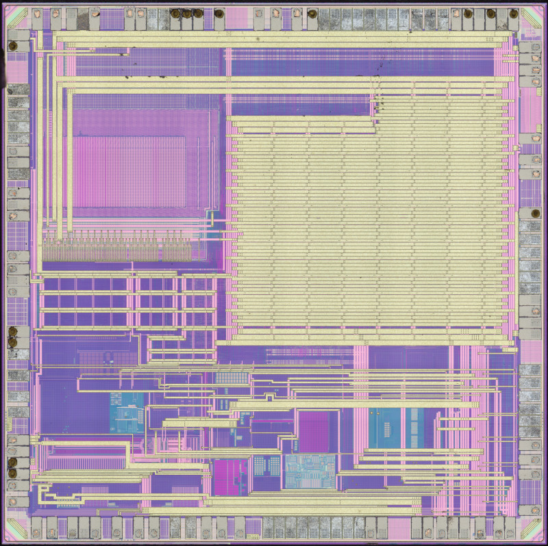 Top metal image of STM32L431. Memory visible in northwest corner, logic area covered by power routing in northeast, analog to the south